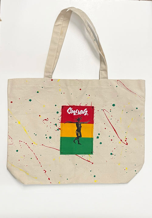 Hand-painted Rasta Splatter Tote Bag with Cooyah patch on natural cotton canvas. 