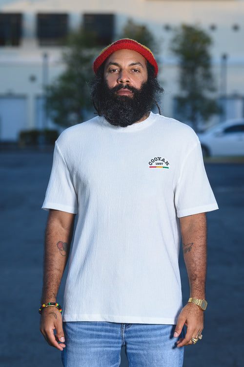 Cooyah Clothing - Men's white cotton gauze fabric shirt with "Cooyah" 1987 embroidered in red, gold, and green on the front. Short sleeve, crew neck shirt. 