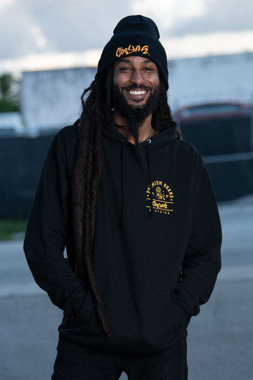 Cooyah Jamaica. Men's black Premium Brand Hoodie with gold lion screen print on the front and back. Jamaican streetwear clothing brand.