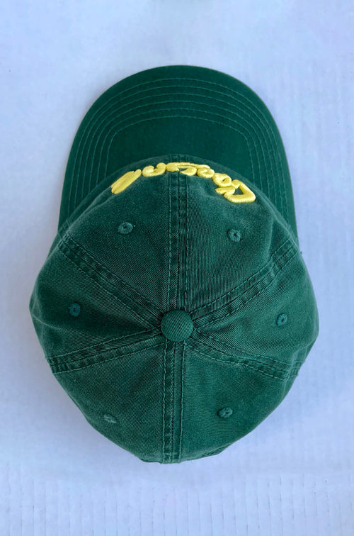 Cooyah clothing.  Men's embroidered hats in green.  Jamaica.