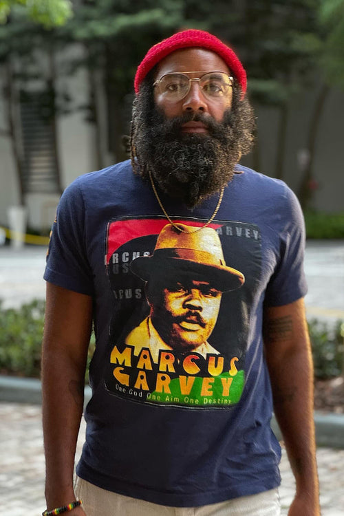 Cooyah Jamaica - Men's Marcus Garvey graphic tee in navy.  Screen printed at Cooyah Studio on soft, 100% ringspun cotton.   As a Jamaican owned clothing brand since 1987, we take pride in bringing you this classic shirt. Don't wait, get yours now!