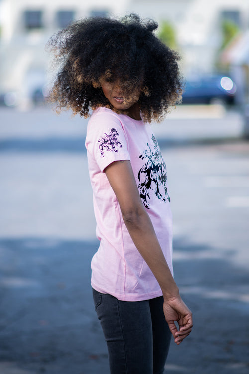 Cooyah rasta lion graphic tee. Women's light pink t-shirt with black lion graphics screen printed on the front and sleeves. Jamaican clothing brand.