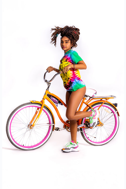 Cooyah Jamaica. Women's Dread and Rasta Lion tie-dye tee. Reggae- style design screen printed on ringspun cotton. As a Jamaican owned clothing brand since 1987, we take pride in bringing you this classic piece. Don't wait, get yours now!