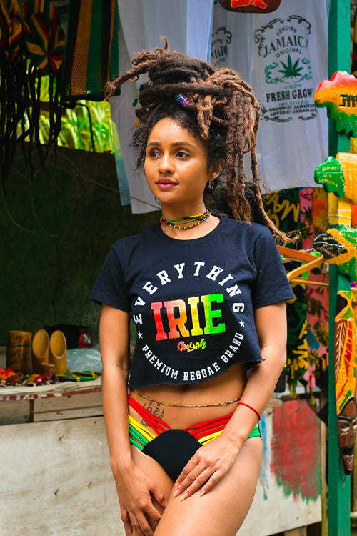 Cooyah Jamaica Everything Irie women's graphic tee screen printed in reggae colors. As a Jamaican owned clothing brand since 1987, we take pride in bringing you this classic piece. 
