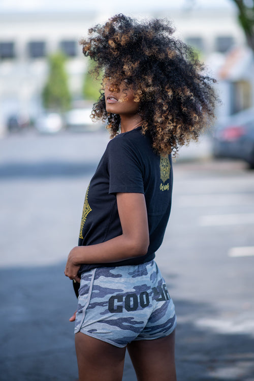 Cooyah Jamaica. Women's black Lion Mandala tee with gold graphics. Jamaican streetwear clothing brand.