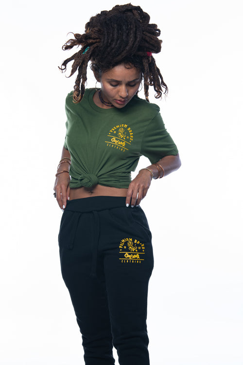 Cooyah Jamaica. Women's black joggers with gold Premium Brand Lion logo screen printed on the front. We are a Jamaican streetwear clothing brand since 1987. IRIE