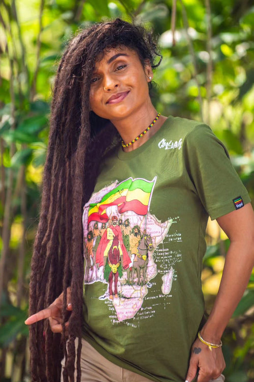 Cooyah Clothing Brand. Haile Selassie with Ethiopian Flag rasta graphic tee. Screen printed on ringspun cotton.  As a Jamaican owned clothing brand since 1987, we take pride in bringing you this classic piece. 