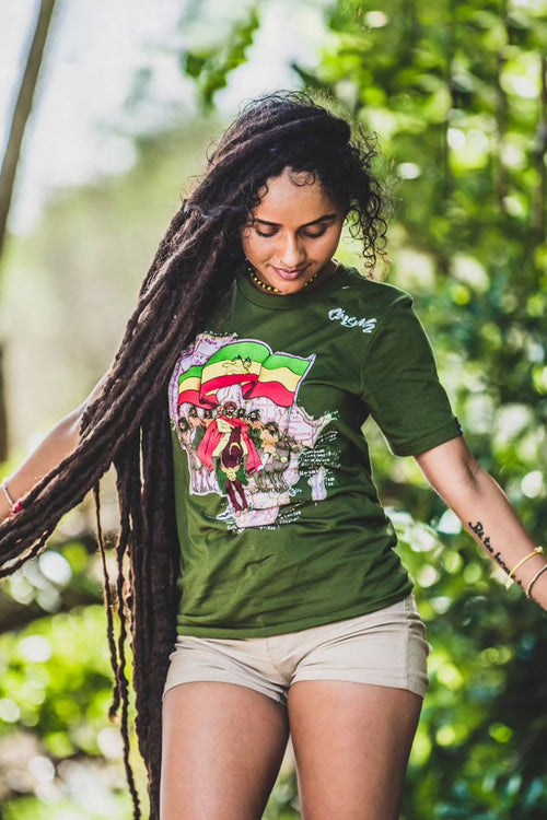 Cooyah Women's Rasta Ethiopian Flag graphic tee featuring Haile Selassie on a horse with Africa Map.  As a Jamaican owned clothing brand since 1987, we take pride in bringing you this classic piece. Don't wait, get yours now!