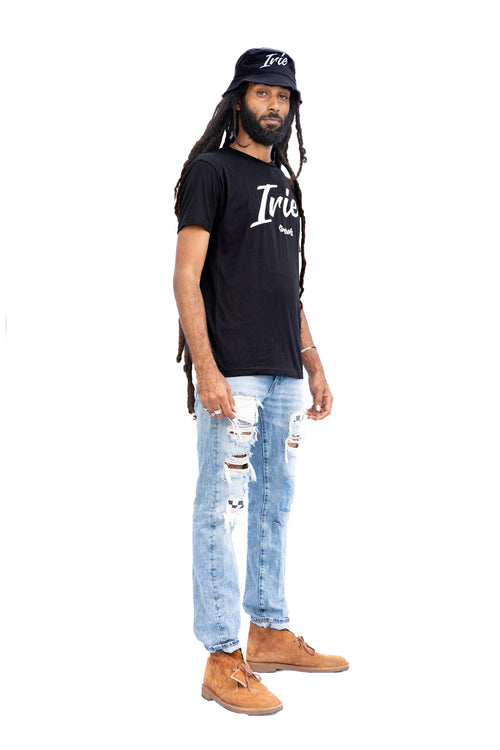 Cooyah Jamaica Irie Yard graphic tee in black. Men's crew neck, short sleeve t-shirt.  As a Jamaican owned clothing brand since 1987, we take pride in bringing you this classic piece. Don't wait, get yours now!