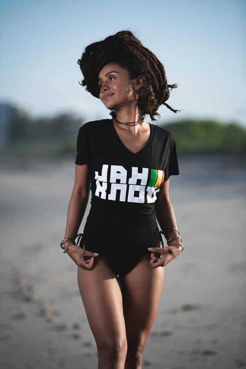 Cooyah Jamaica - Women's Jah Know V-Neck graphic tee in black.  Screen printed at Cooyah Studio in Miami with reggae colors.  As a Jamaican owned clothing brand since 1987, we take pride in bringing you this classic piece. 