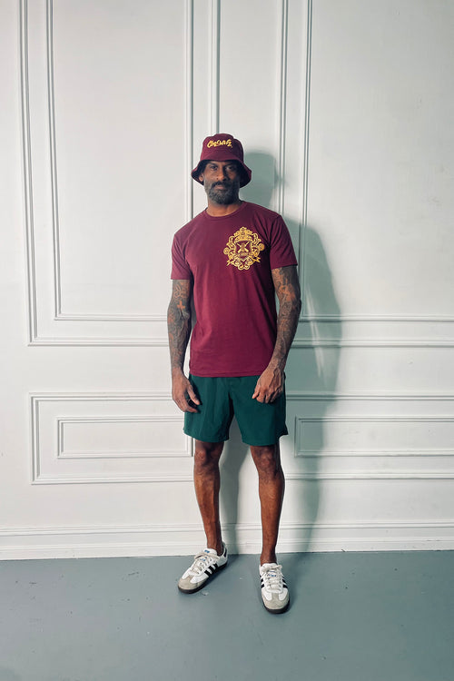 Cooyah Clothing. Men's Cricket Club graphic tee in maroon. Screen printed with gold logo on the front and back.