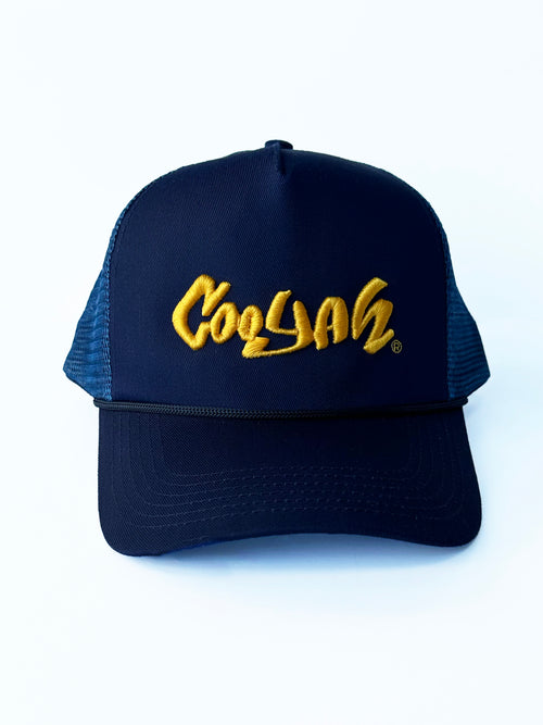 COOYAH Embroidered Trucker Hat in Navy Blue.  As a Jamaican owned clothing brand since 1987, we take pride in bringing you this classic piece. Don't wait, get yours now!