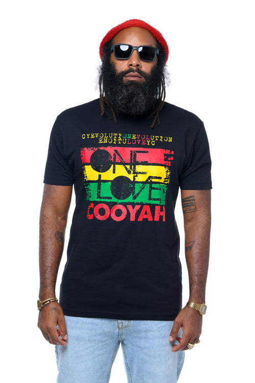 Cooyah Clothing Brand- Reggae artist, Lan Lawd wearing a black t-shirt with 'One Love' Evolution text and graphics in rasta colors, red beanie, and sunglasses on a white background.