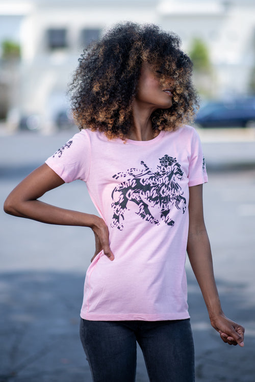 Cooyah rasta lion graphic tee. Women's light pink t-shirt with black lion graphics screen printed on the front and sleeves. Jamaican clothing brand.