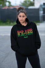 Load image into Gallery viewer, Cooyah Bad Mind Racism hoodie screen printed in reggae colors on a black hoodie
