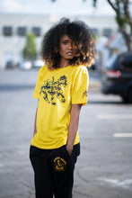 Load image into Gallery viewer, Cooyah Jamaica graphic tee with Rasta Lion. Yellow women&#39;s t-shirt with black lion graphics screen printed on the front and sleeves.
