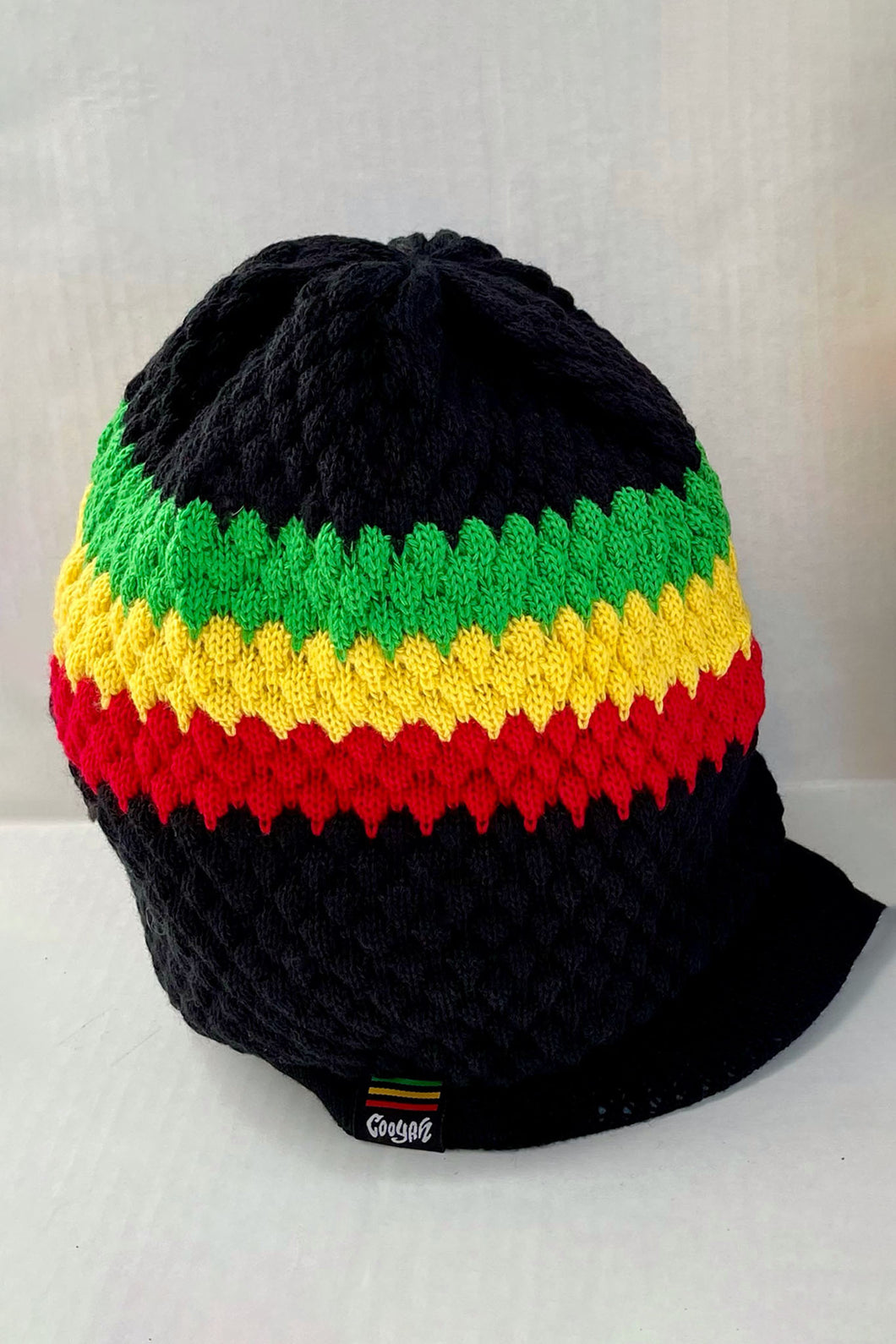 Cooyah Jamaica. Knit Rasta Tam with brim. Jamaican rootswear clothing brand. The perfect hat for dread locks. IRIE