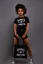 Load image into Gallery viewer, Cooyah Jamaica. Reggae VS Babylon tee in black. Women&#39;s short sleeve, ring spun cotton t-shirt. Jamaican streetwear clothing brand.
