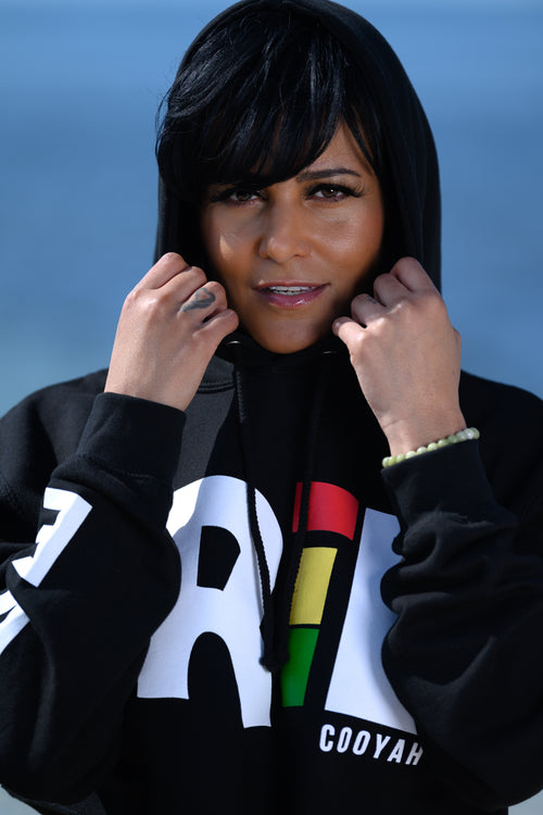 Cooyah Clothing - Women's cropped hoodie with Irie print on the front in reggae colors.