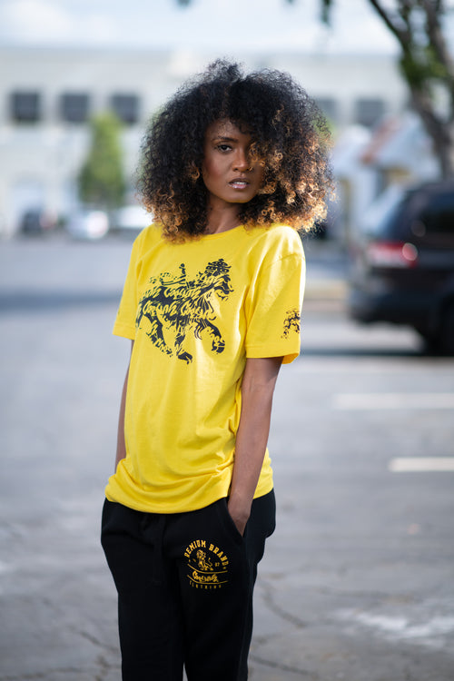 Cooyah Jamaica graphic tee with Rasta Lion. Yellow women's t-shirt with black lion graphics screen printed on the front and sleeves.