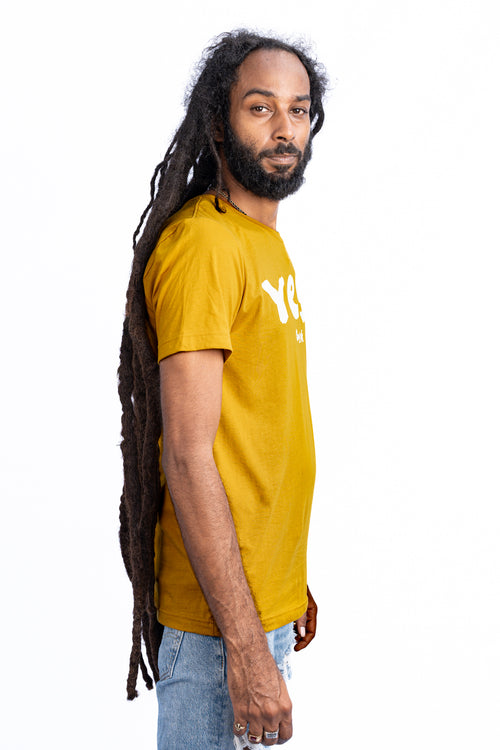 Cooyah Jamaica - Men's musterd yellow Yes I graphic tee.  Screen printed in reggae colors.  As a Jamaican owned clothing brand since 1987, we take pride in bringing you this classic shirt. Don't wait, get yours now!