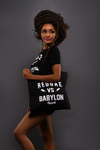 Load image into Gallery viewer, Cooyah Jamaica. Reggae VS Babylon tee in black. Women&#39;s short sleeve, ring spun cotton t-shirt. Jamaican streetwear clothing brand. IRIE
