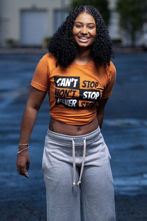 Cooyah Can't Stop Won't Stop Boyfriend Fit Tee in orange.