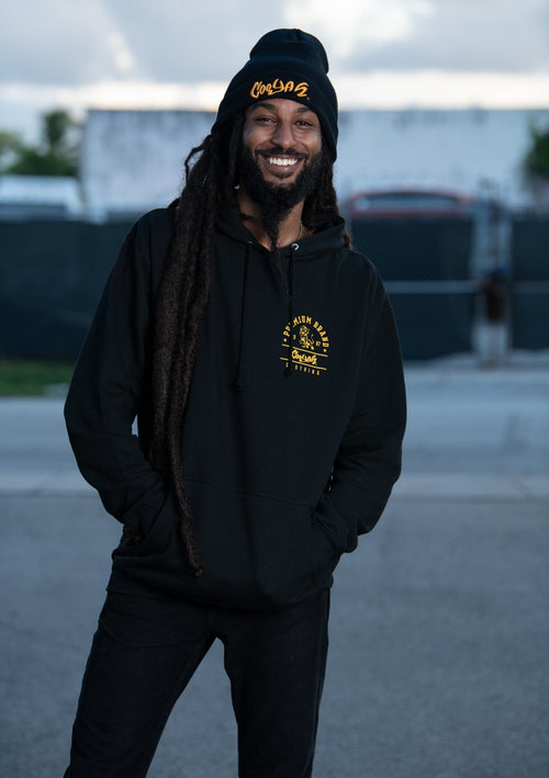 Cooyah Jamaica. Men's black Premium Brand Hoodie with gold lion screen print on the front and back. Jamaican streetwear clothing brand.