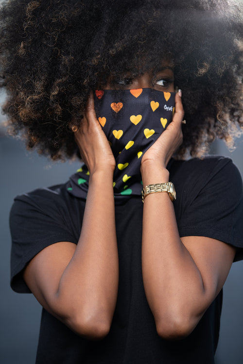 These Cooyah brand gaiters are the perfect fit for outdoor activities. They are multifunctional and can be worn as a scarf, headband, or mask to keep dust from your face. One Love, reggae heart design.
