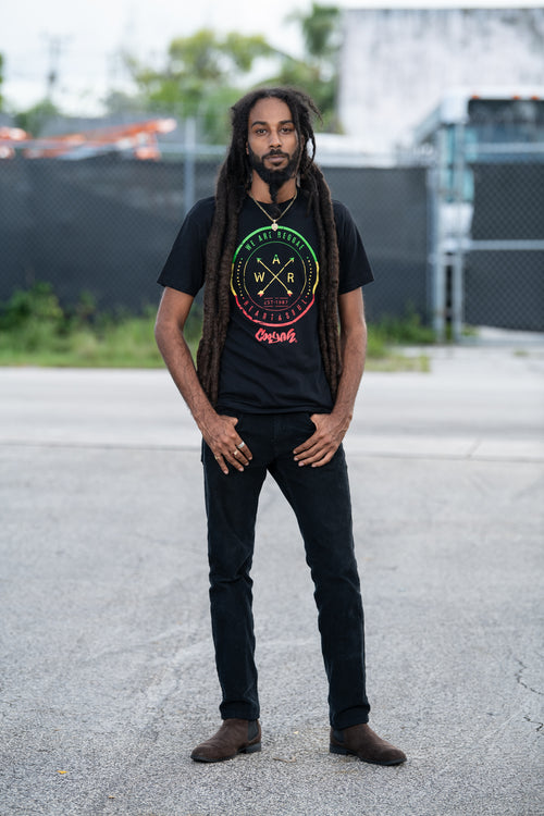 We Are Reggae men's graphic tee by Cooyah Jamaica. Short sleeve, crew neck, soft ringspun cotton. Black shirt with rasta color screen print. Jamaican streetwear clothing brand.  IRIE