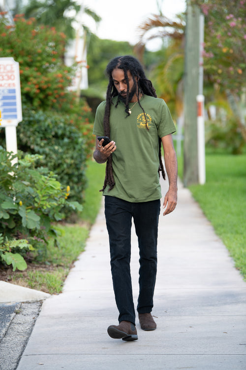 Cooyah Jamaica. Men's Premium Brand graphic tee. Gold Lion design screen printed on a black ringspun cotton t-shirt. Jamaican streetwear clothing brand.