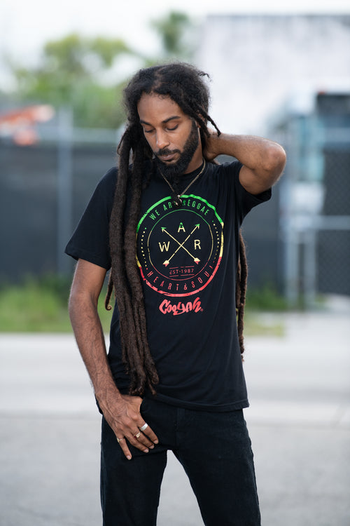 We Are Reggae men's graphic tee by Cooyah Jamaica. Short sleeve, crew neck, soft ringspun cotton. Black shirt with rasta color screen print. Jamaican streetwear clothing brand.