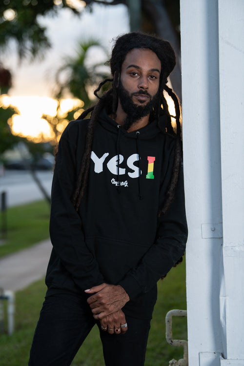 Cooyah Clothing. Men's Yes I Jamaica hoodie in black. Screen printed design in reggae colors. Jamaican streetwear clothing. IRIE