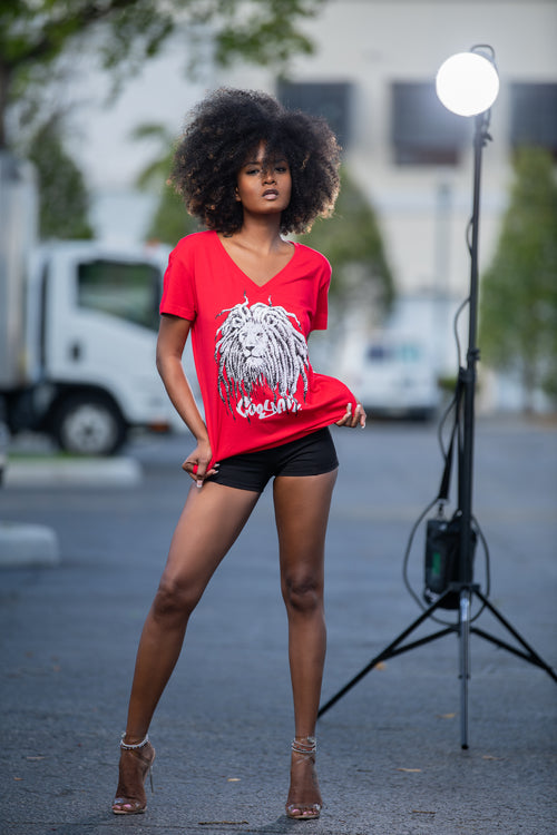 Cooyah Jamaica - Women's red v-neck graphic tee with Rasta Lion Dreads design.  As a Jamaican owned clothing brand since 1987, we take pride in bringing you this classic piece. Don't wait, get yours now!