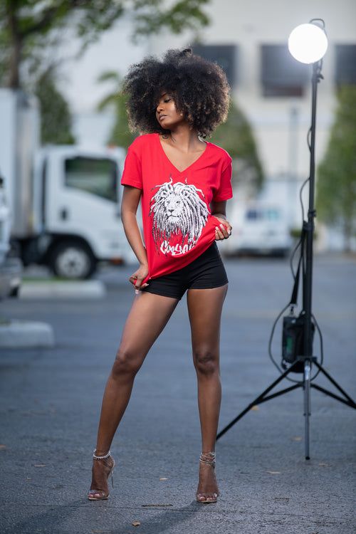 Cooyah Jamaica - Women's red v-neck graphic tee with Rasta Lion Dreads design.  As a Jamaican owned clothing brand since 1987, we take pride in bringing you this classic piece. Don't wait, get yours now!