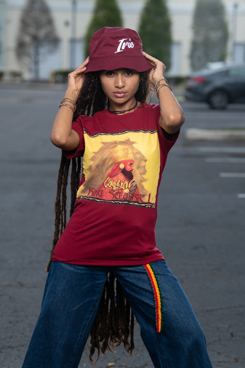 Cooyah Clothing.  Haile Selassie Rastafari Lion graphic tee in burgundy.  Crew neck, short sleeve, soft, ringspun cotton.  Rasta.  As a Jamaican owned clothing brand since 1987, we take pride in bringing you this classic shirt. Don't wait, get yours now!