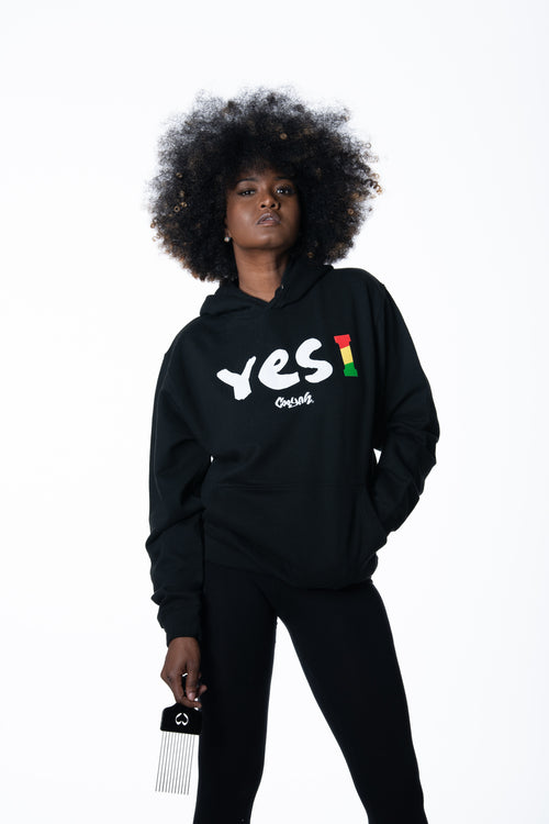 Cooyah Clothing. Women's Yes I Jamaica hoodie in black. Screen printed design in reggae colors. Jamaican streetwear clothing. IRIE