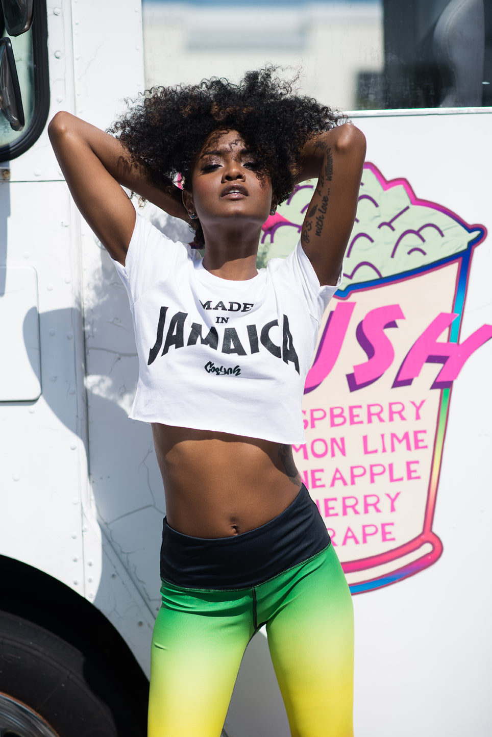 Cooyah Clothing. Made in Jamaica women's white crop top graphic tee with black screen print. Ringspun cotton, short sleeve, crew neck t-shirt. Jamaican clothing brand.