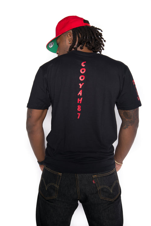 Cooyah Jamaica. Men's See We Yah graphic tee screen printed in rasta colors. Jamaican streetwear clothing brand.