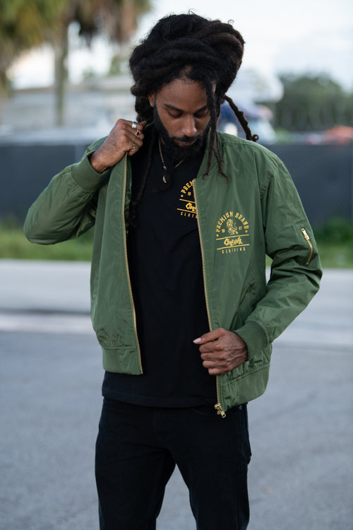 Cooyah Clothing - Men's Premium Brand Bomber Jacket in olive green.  Original Lion design screen printed at Cooyah Studio.  We are Jamaican streetwear clothing brand established in 1987