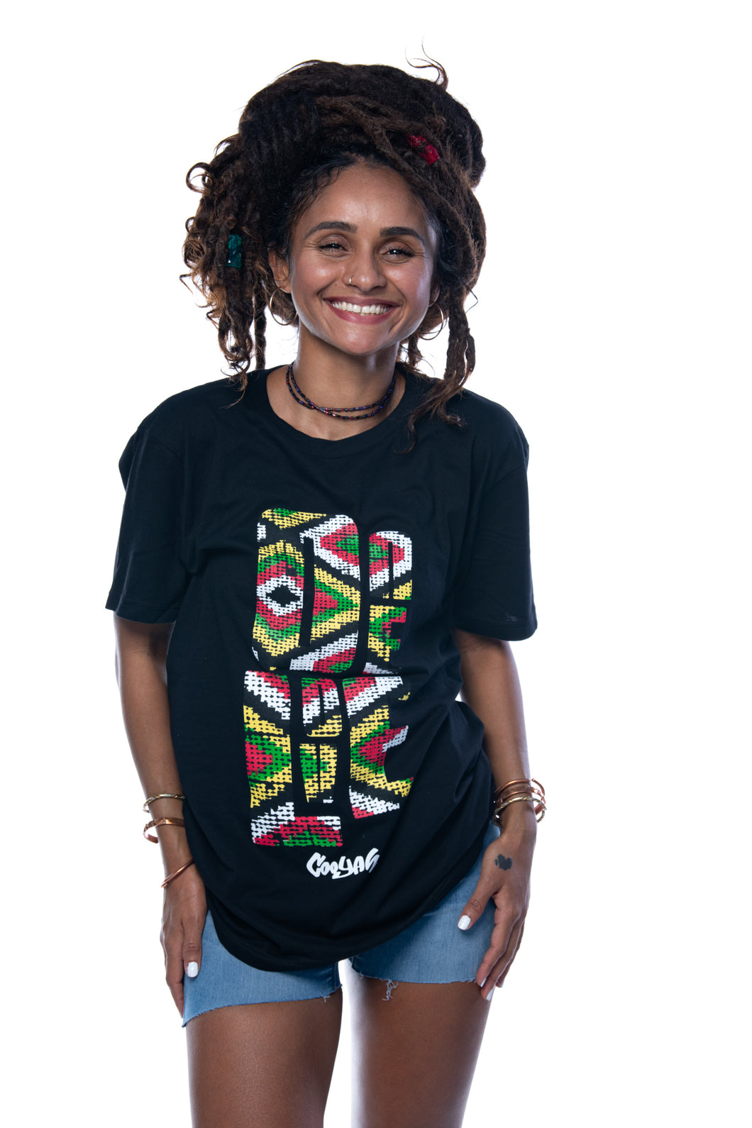Cooyah Jamaica.  One Love Africa Print graphic tee.  Women's short sleeve, ringspun cotton tee in black.  Jamaican clothing brand.