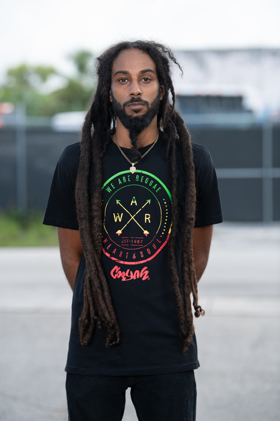 We Are Reggae men's graphic tee by Cooyah Jamaica.  Short sleeve, crew neck, soft ringspun cotton.  Black shirt with rasta color screen print.  Jamaican streetwear clothing brand.
