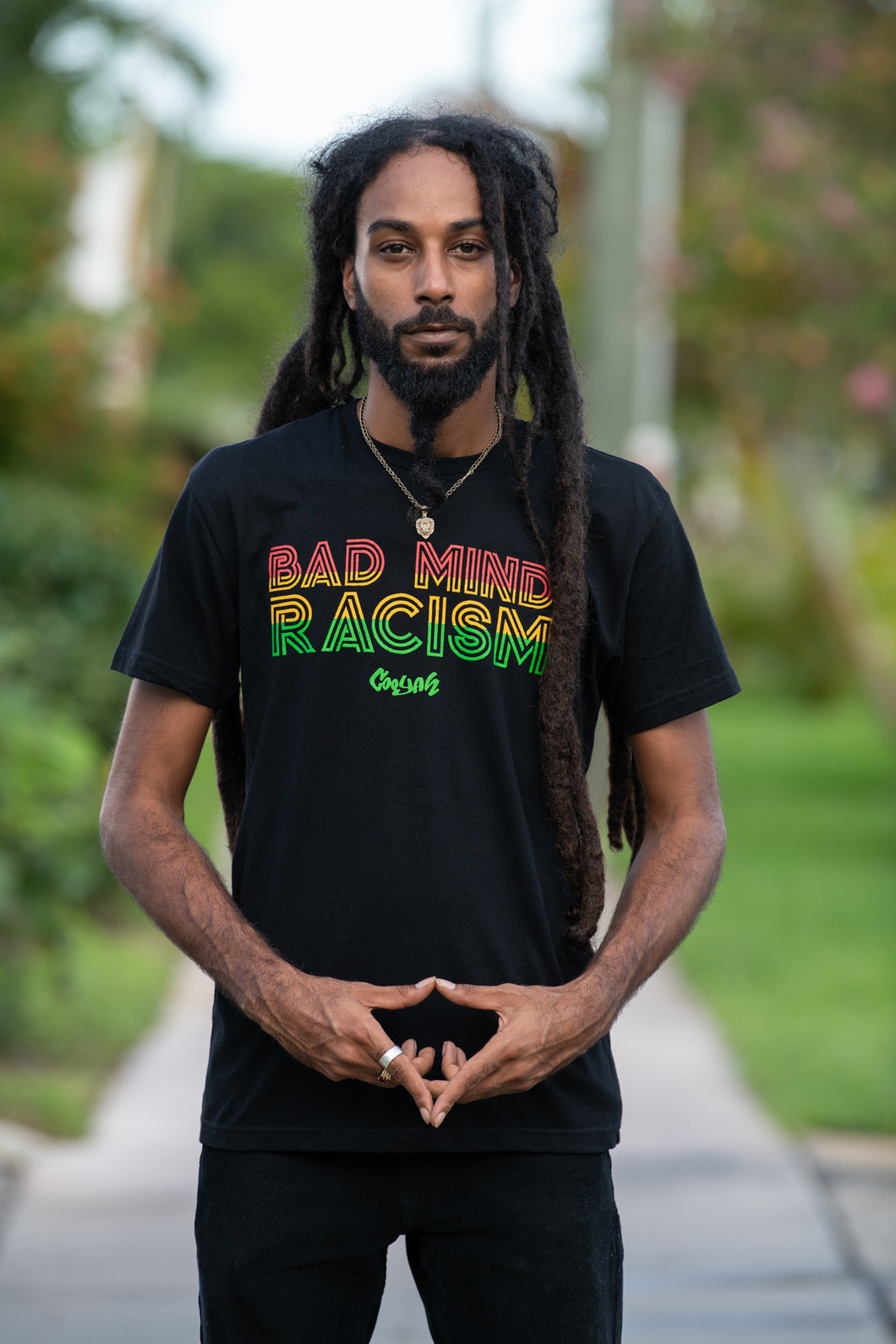 Cooyah Jamaica. Men's reggae graphic tees with Bad Mind Racism graphics screen printed in rasta colors. Jamaican owned clothing brand since 1987. Rastafari