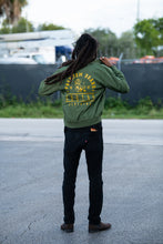 Load image into Gallery viewer, Cooyah Clothing. Men&#39;s Premium Brand Bomber Jacket with gold Lion print on olive green fabric. Jamaican streetwear clothing brand.
