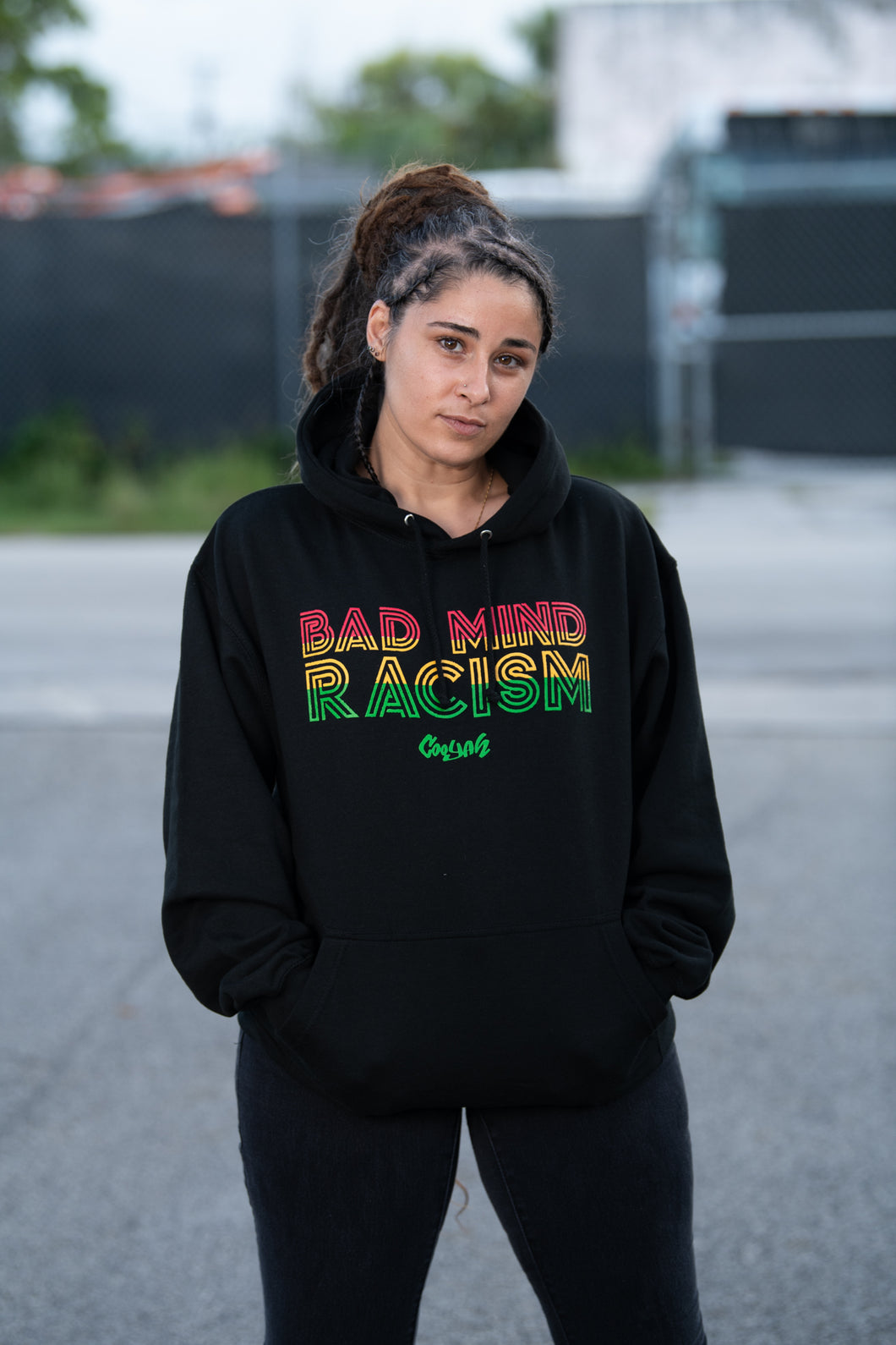 Cooyah Bad Mind Racism hoodie screen printed in reggae colors on a black hoodie