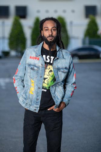 Cooyah Jamaica.  Men's denim jacket with Rasta Lion design.  Handprinted design.  Reggae rootswear clothing brand.  IRIE
