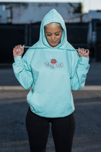 Load image into Gallery viewer, Cooyah Jamaica women&#39;s Embroidered Rose Pullover Hoodie in mint green. Floral design, Jamaican streetwear clothing.
