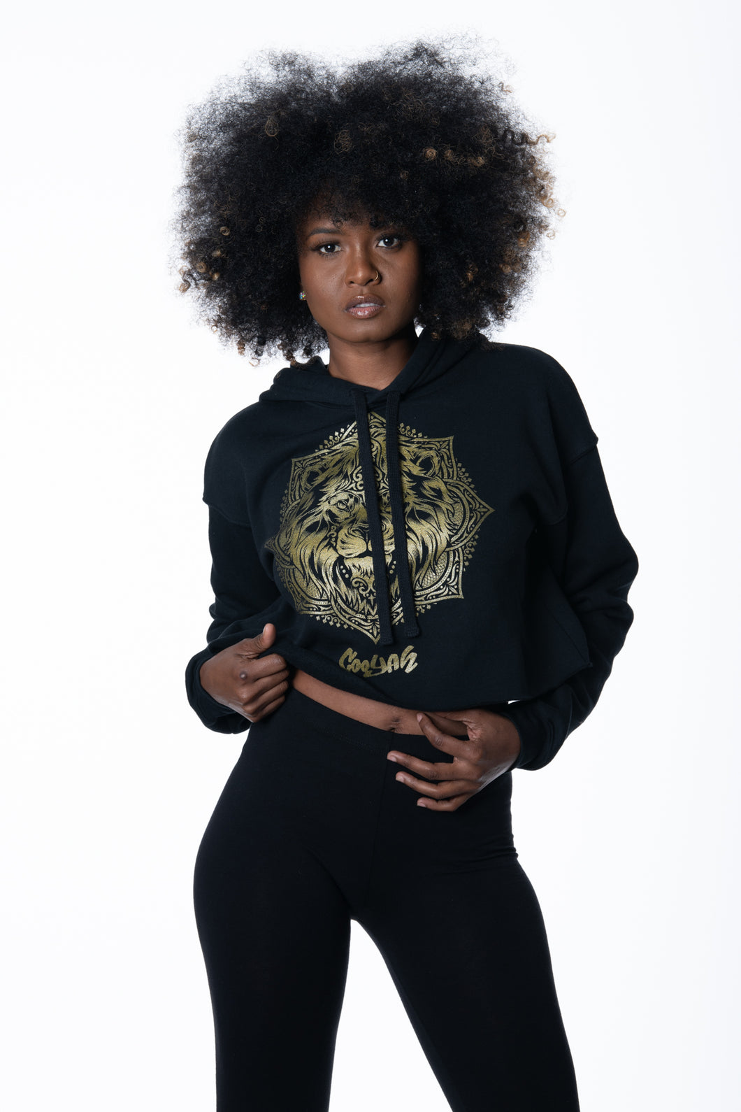 Cooyah Jamaica. Women's black Lion Mandala cropped hoodie with metallic gold print. Jamaican clothing brand.