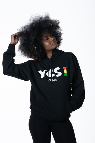 Cooyah Clothing. Women's Yes I Jamaica hoodie in black. Screen printed design in reggae colors. Jamaican streetwear clothing. IRIE