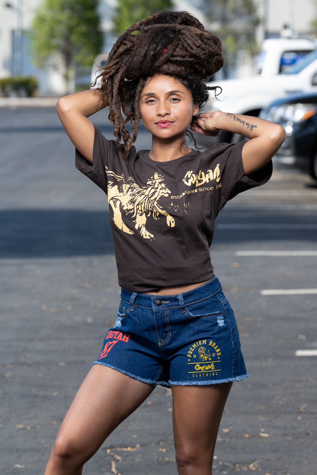Cooyah Jamaica.  Women's Rasta Lion graphic tee in brown.  Short Sleeve, crew neck, ringspun cotton t-shirt.  Jamaican clothing brand.